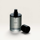 House of Holabox Hash Extrait de Parfum 50ml glass bottle with black cap on a reflective silver surface