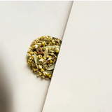 House of Holabox loose leaf herbal tea blend featuring dried chamomile flowers and native Australian Jilungin leaves.