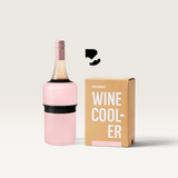 House of Holabox Huski wine cooler in powder pink with a wine bottle and its branded packaging box