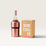 House of Holabox Huski wine cooler in rose gold stainless steel with a wine bottle inside next to its product box