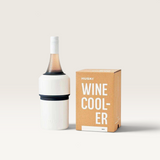House of Holabox Huski white stainless steel wine cooler with a bottle inside next to its branded cardboard packaging