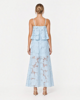 Back view of House of Holabox icy blue sheer floral tiered midi dress with adjustable straps and slip skirt lining