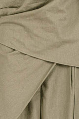 House of Holabox Imogen pant set in olive green cotton-linen blend featuring a wrap tie panel and pleat detail