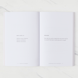 House of Holabox inspirational paperback book open to pages 78 and 79 featuring self-love poetry by Charlotte Freeman