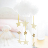 House of Holabox ivory tulle cloud nursery mobile with hanging sparkling gold stars for a dreamy celestial theme.
