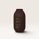 House of Holabox Ivy Ila Finest Floral body polish in a dark brown 200g squeeze bottle for gentle skin exfoliation.
