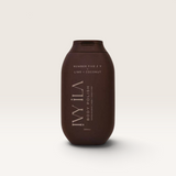 House of Holabox Ivy Ila Lime and Coconut body polish in a dark brown 200ml squeeze bottle for exfoliating skin.