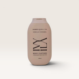 House of Holabox Ivy Ila Vanilla Caramel body custard in a beige 200ml bottle with minimalist black typography.
