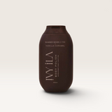 House of Holabox Ivy Ila Vanilla Caramel sugar body polish in a dark brown 200g bottle for exfoliating skin.