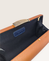 House of Holabox Izoa Bianca clutch in cocoa brown PU leather with a gold-tone clasp and dark interior lining
