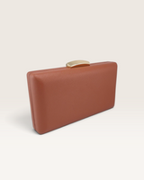 House of Holabox Izoa Bianca clutch in cocoa brown PU leather with a polished gold-tone clasp closure.