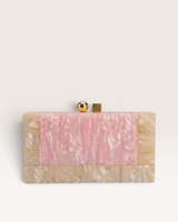 House of Holabox Izoa Brooke pink marble acrylic clutch with a glossy finish and signature gold round and square clasp.