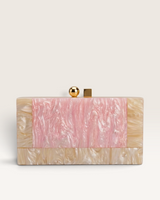 Izoa Brooke Marble Clutch in pink with high-gloss two-toned marble acrylic, gold clasp, and detachable chain strap