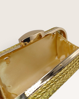 House of Holabox Izoa Helen gold clutch with a rope-wrapped exterior and polished gold hardware interior view