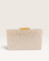 House of Holabox Izoa Krista clutch in cream marble acrylic with a glossy finish and gold top clasp, reverse view