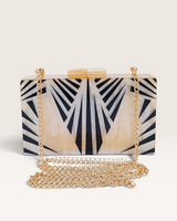 House of Holabox Izoa Krista clutch in cream marble acrylic with graphic black stripes and a detachable gold chain strap.