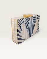 House of Holabox Izoa Krista clutch in cream marble acrylic with graphic black stripes and gold top clasp