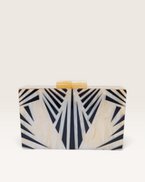 House of Holabox Izoa Krista clutch in cream marble acrylic with graphic black staggered stripes and gold top clasp.
