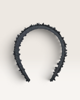 House of Holabox Izoa Rosalie black floral headband with dimensional flower-cut fabric and pearl embellishments.