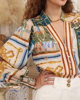 House of Holabox Jacquline shirt featuring equestrian motifs, heritage stripes, and mixed decorative buttons in teal.