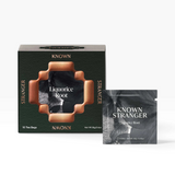 House of Holabox Known Stranger Liquorice Root tea box and individual sachet with elegant black and copper packaging.