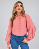 House of Holabox Lani shirred blouse in dusty rose with smocked collar, button front, and blouson sleeves on a model.