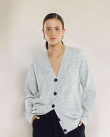 House of Holabox Lee Longline Cardi in heather grey, made from a soft polyester blend with black button closure.