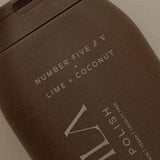 House of Holabox Ivy Ila lime and coconut body polish in a dark brown container with minimalist white text