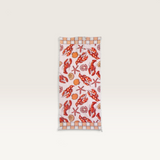 House of Holabox quick-drying microfibre beach towel featuring a red lobster and seashell print with tassel trim.