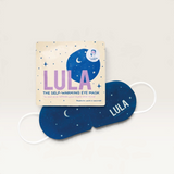 House of Holabox Lula self-warming eye mask in navy blue with moon and star print and its matching lavender pouch.