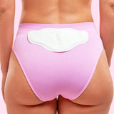House of Holabox Lula self-warming body patch applied to the back of pink underwear for soothing heat relief.