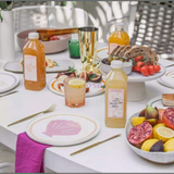 House of Holabox Margarita Margarita classic citrus cocktail mix bottles on a table set for a summer brunch