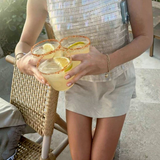 House of Holabox Margarita Margarita mix served in three glasses with chili salt rims and fresh lime wedges
