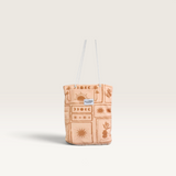 House of Holabox microfibre beach towel in a matching drawstring bag with a tan sun and palm tree print.