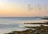 House of Holabox Midnight Sun cookbook table of contents page featuring a serene Nordic coastal sunset background