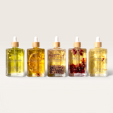 House of Holabox Soaked Body Bar nourishing bath and body oils in five glass dropper bottles with botanical infusions.