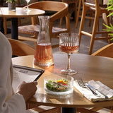 House of Holabox Pasabahce Elysia glassware set featuring a stemmed gin glass, carafe, and bowl on a wooden table.