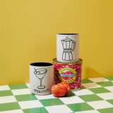 House of Holabox Pepe Aperitivo ceramic holdall jars with cocktail and moka pot illustrations on a checkered table.