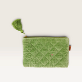 House of Holabox Kip and Co quilted pesto green velvet cosmetics purse with a decorative tassel and zip closure.