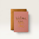 House of Holabox baby greeting card in dusty pink with gold foil Welcome Little One lettering and metallic envelope