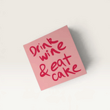 House of Holabox Salty Melon Prints pink greeting card with red handwritten text Drink wine and eat cake