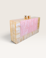 House of Holabox Izoa Brooke pink marble acrylic clutch with a glossy finish and signature gold dual top clasp.
