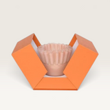 House of Holabox Ben David Soy Kiki candle in a ruffled pink glass vessel inside an open orange gift box