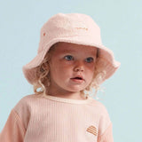House of Holabox Banabae pink cotton terry bucket hat with embroidered Rad Kid logo on a toddler