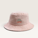House of Holabox pink cotton terry towelling bucket hat with embroidered Rad Kid sun logo for kids