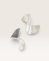 House of Holabox Obus Moonsong earrings in platinum with a sculptural, curved, and pleated metallic design.