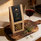 House of Holabox Port Willunga Fine Foods Fleurieu green olives in a 100g pack with red wine on a wooden board