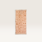 House of Holabox quick-drying microfibre beach towel in a postcard print with a matching storage bag.