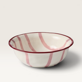 House of Holabox Ecology Porto Sable stoneware serving bowl in raspberry with handpainted red stripes and maroon rim.