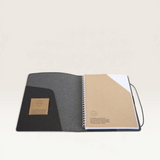 House of Holabox A5 recycled leather journal open to show inner pocket, business card slits, and spiral notepad.